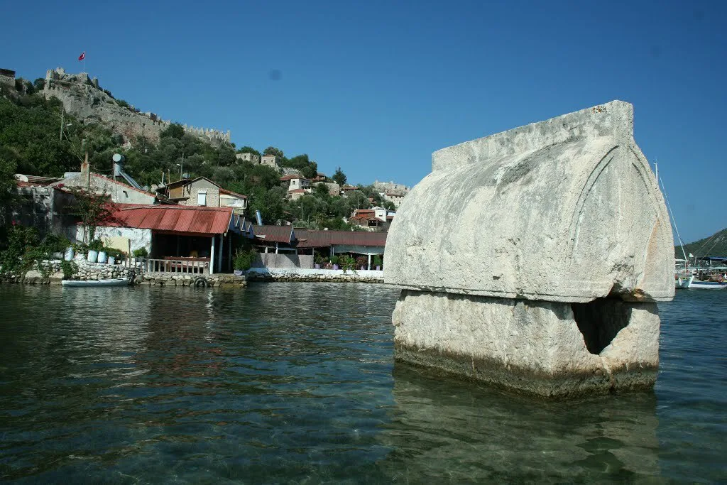 A Lycian sarcophagus standing in the water at Kaleköy, ancient Simena.