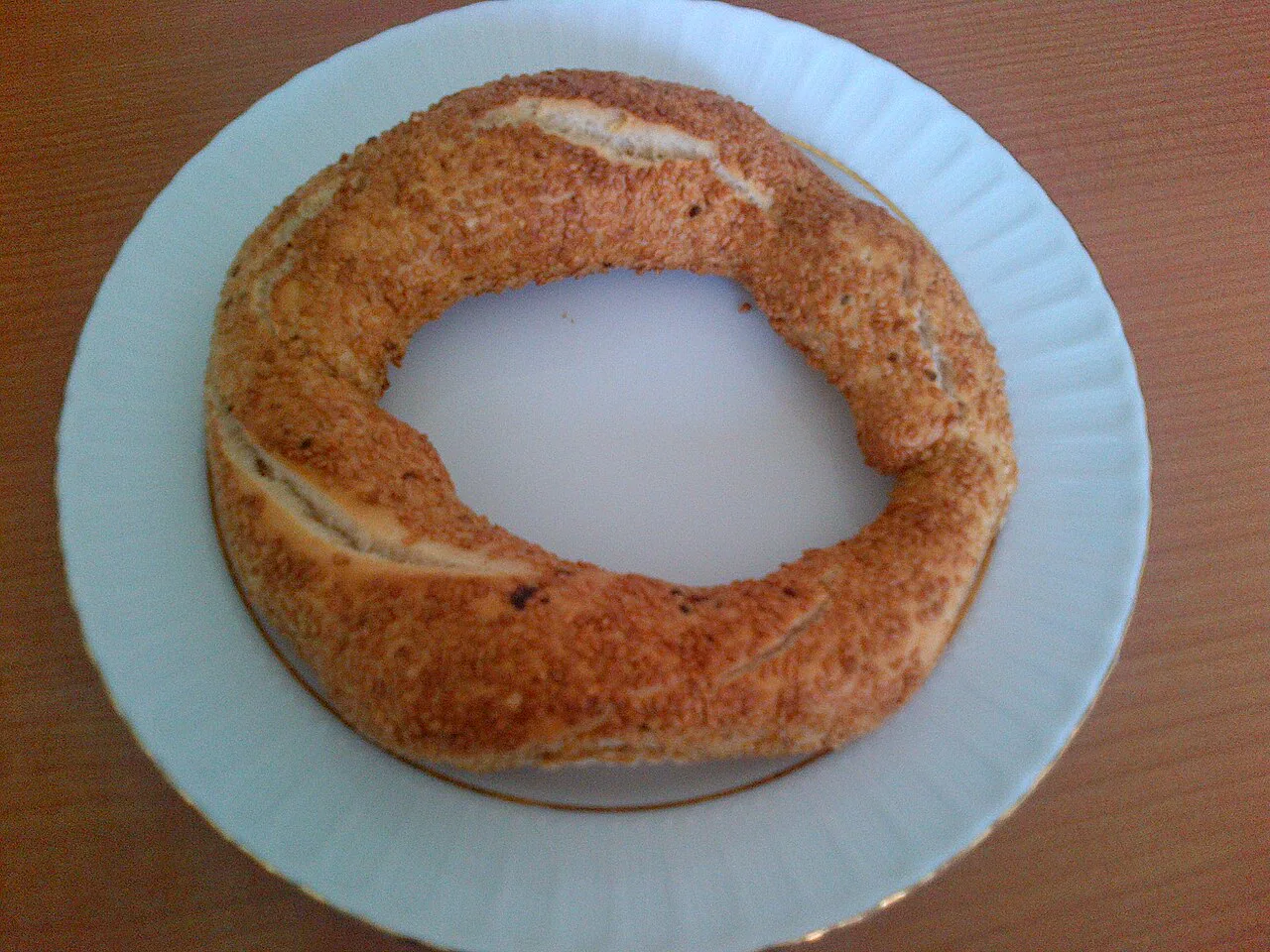 A sesame simit on a plate in Ankara.