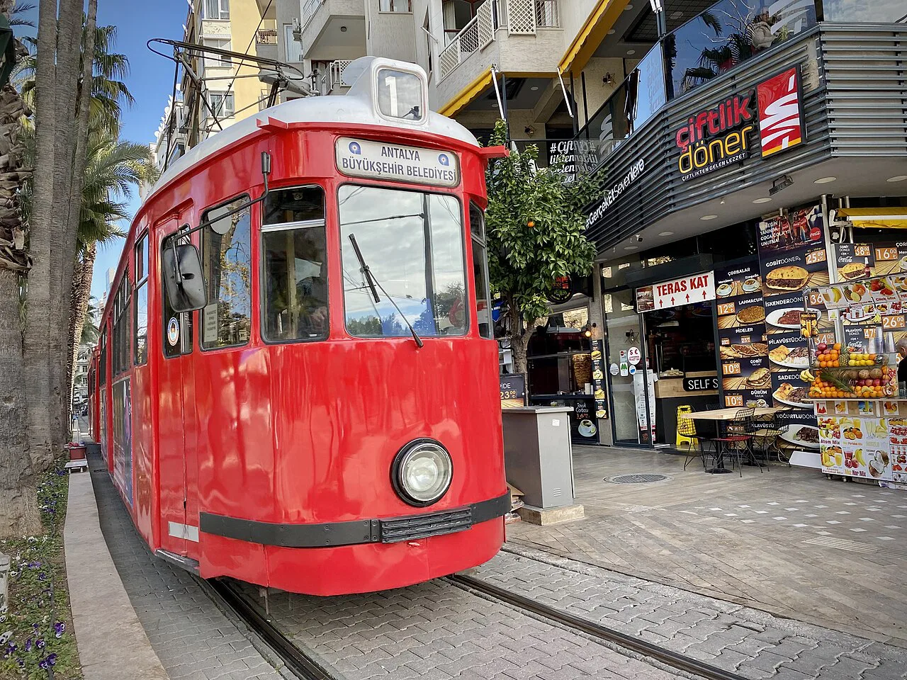 Antalya's red nostalgic tram near Kaleiçi old town.