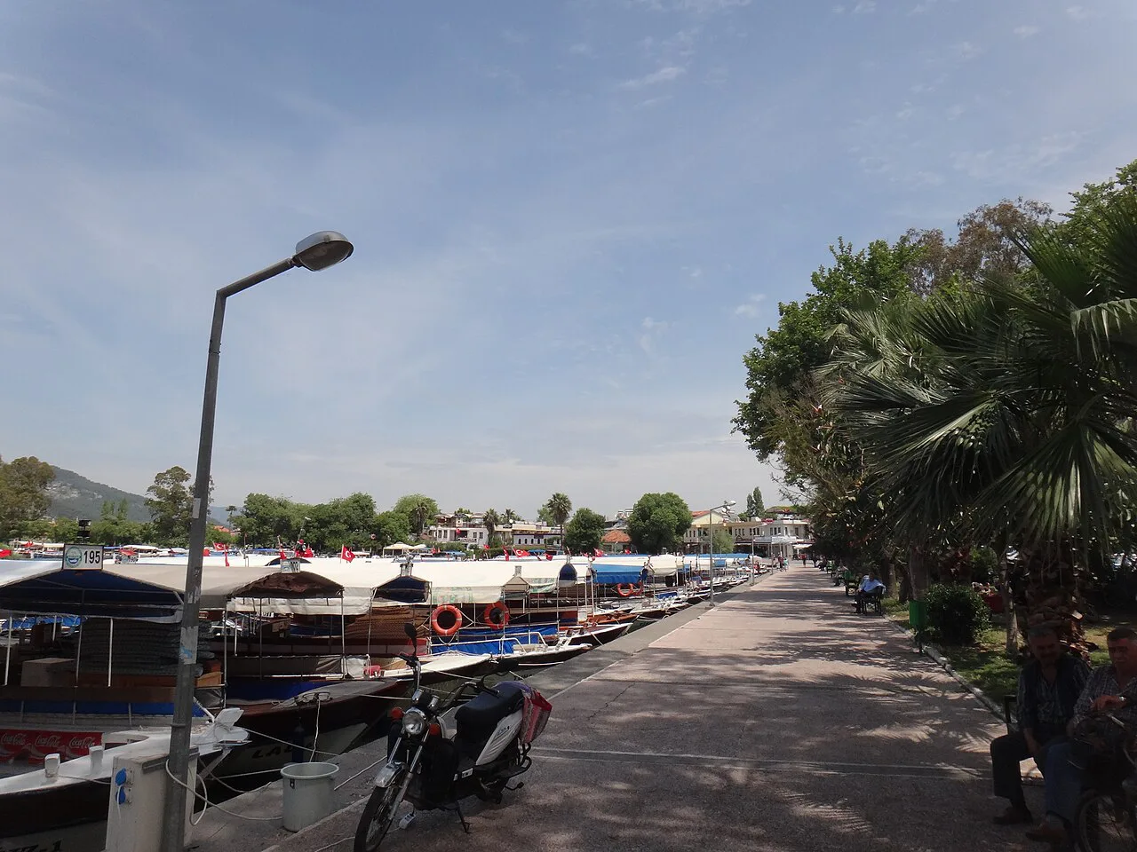 The riverside promenade with moored boats in Dalyan.