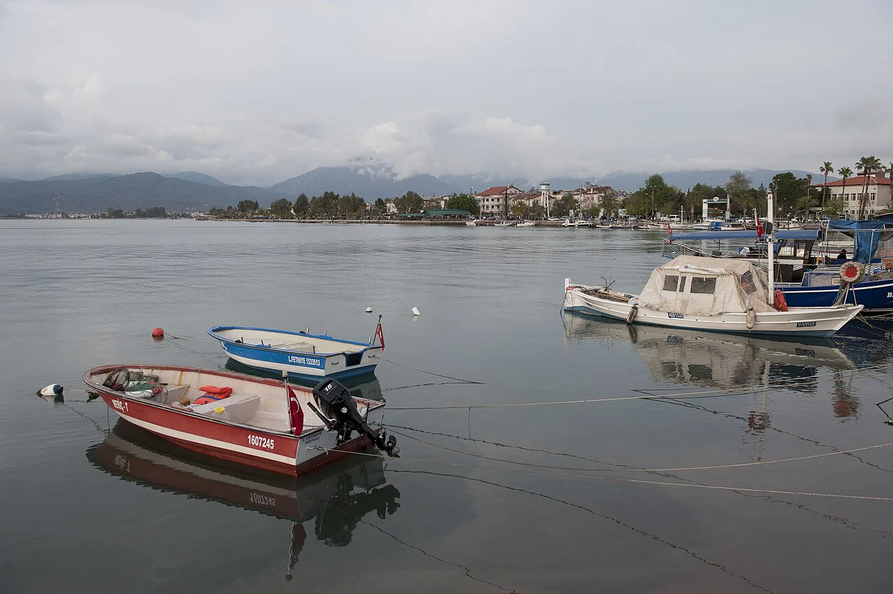 Small boats on the calm water of Fethiye bay.
