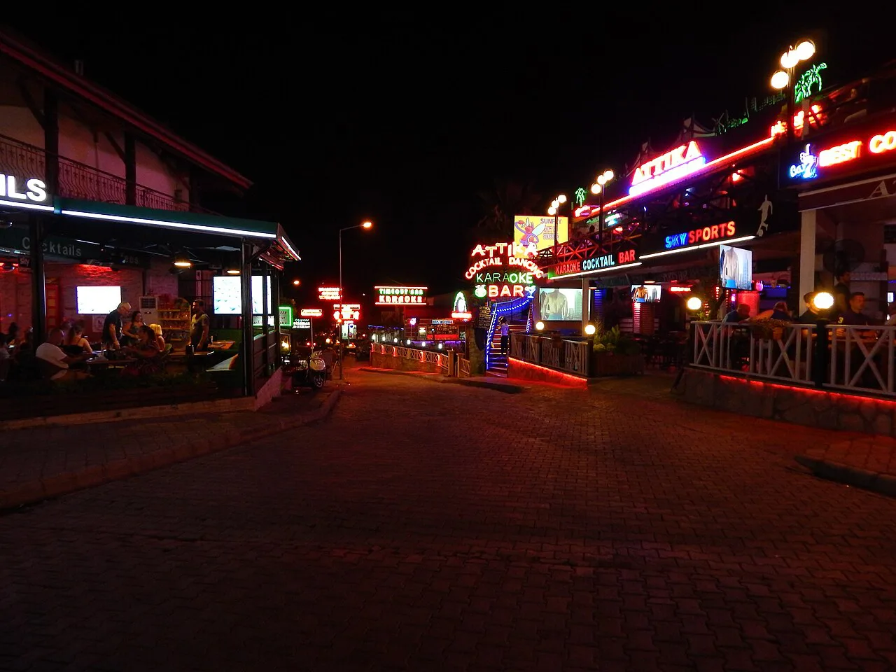Hisarönü's bar street lit up at night.