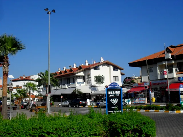 Shops and buildings along a street in İçmeler.