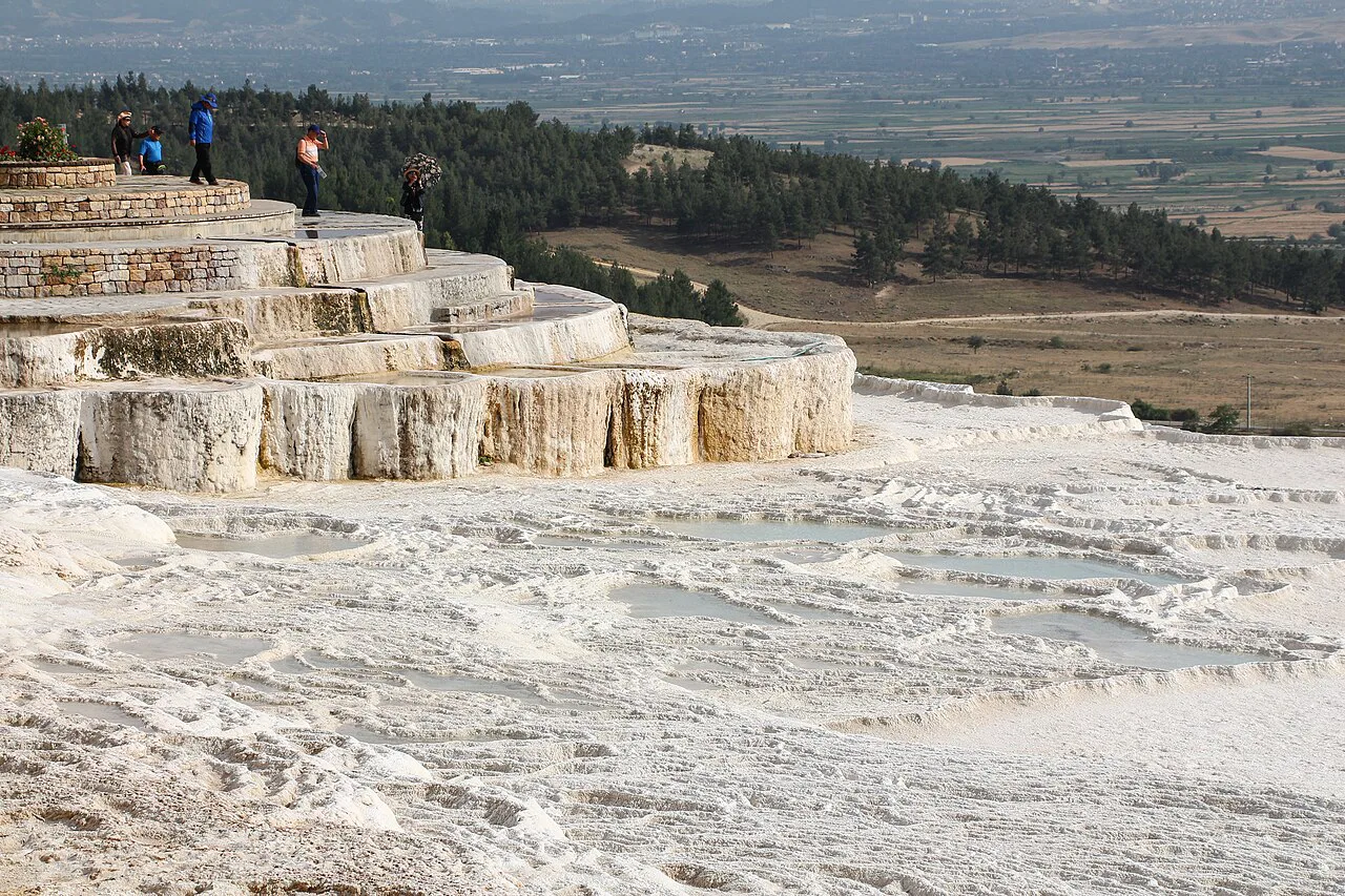 Travertine terraces at Pamukkale above the plain.