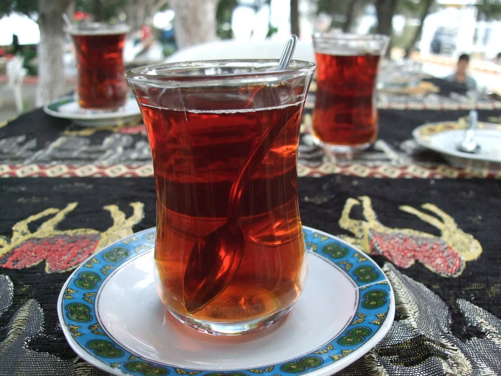 A glass of Turkish tea on its saucer, served in Bergama.