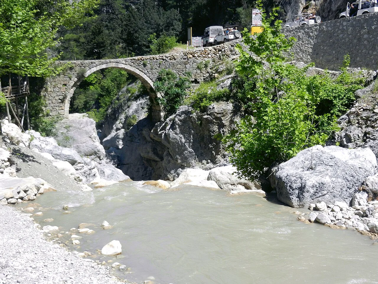 An old stone bridge over a river on the Kemer–Gedelme jeep safari route.