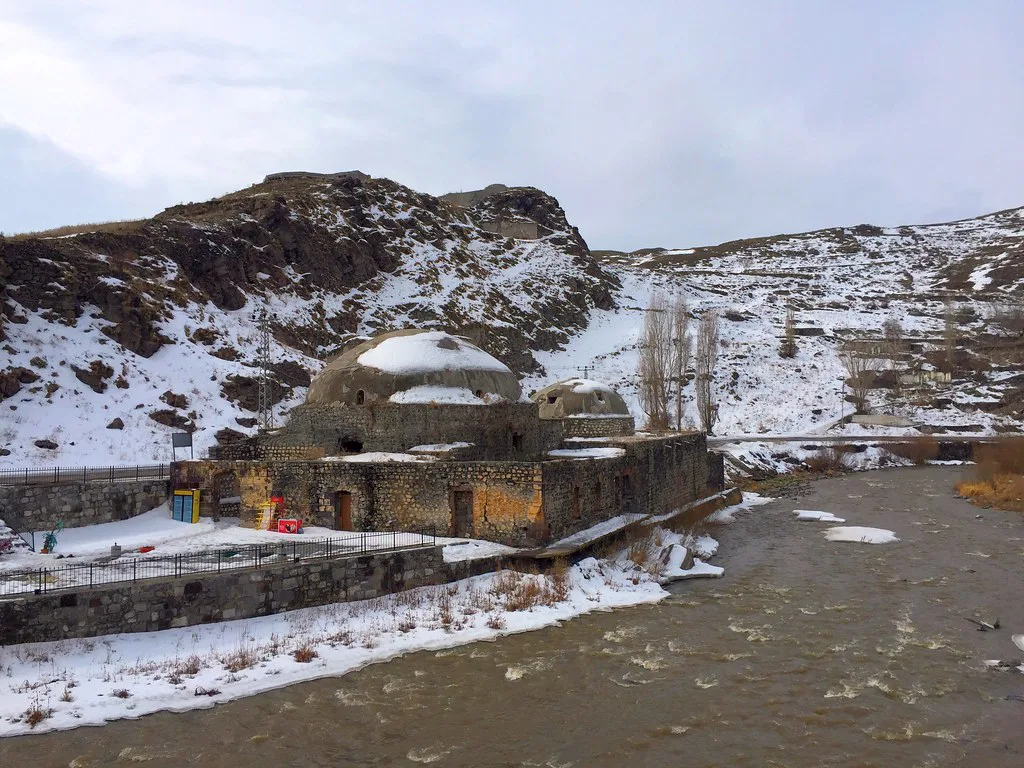 The old Muradiye Hamam beside the river in Kars, eastern Turkey, in winter.