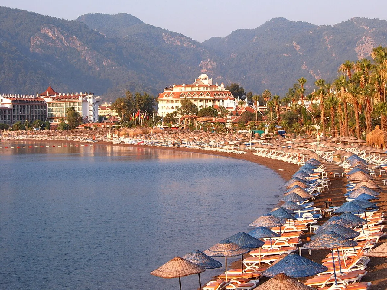 İçmeler beach curving around the bay below the mountains.