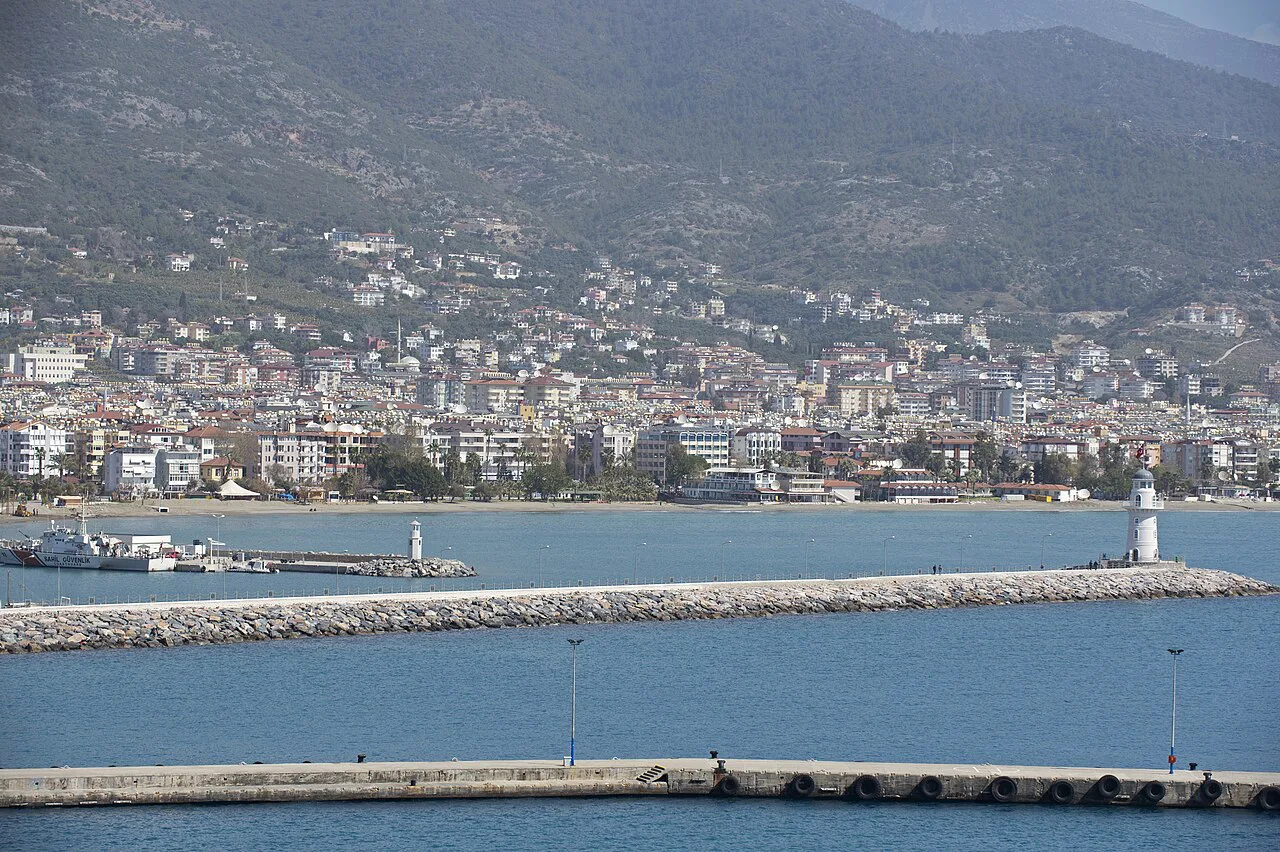 Alanya town and harbour breakwater with its lighthouse.