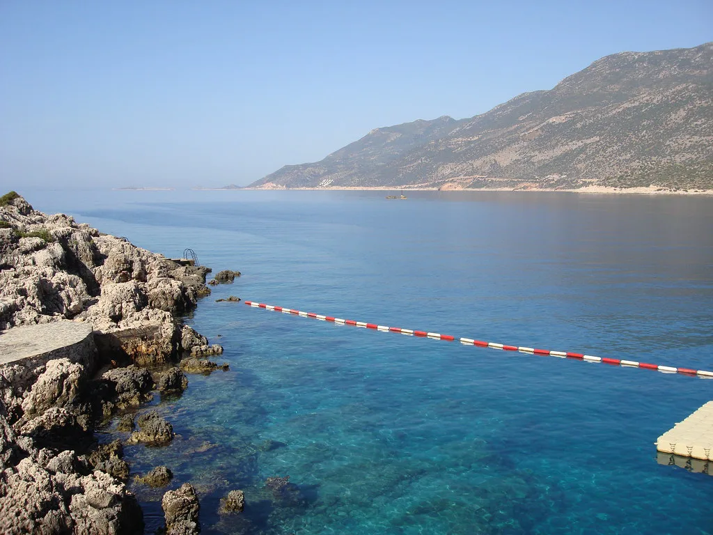 Rocky shore and clear blue water on the coast at Kaş.
