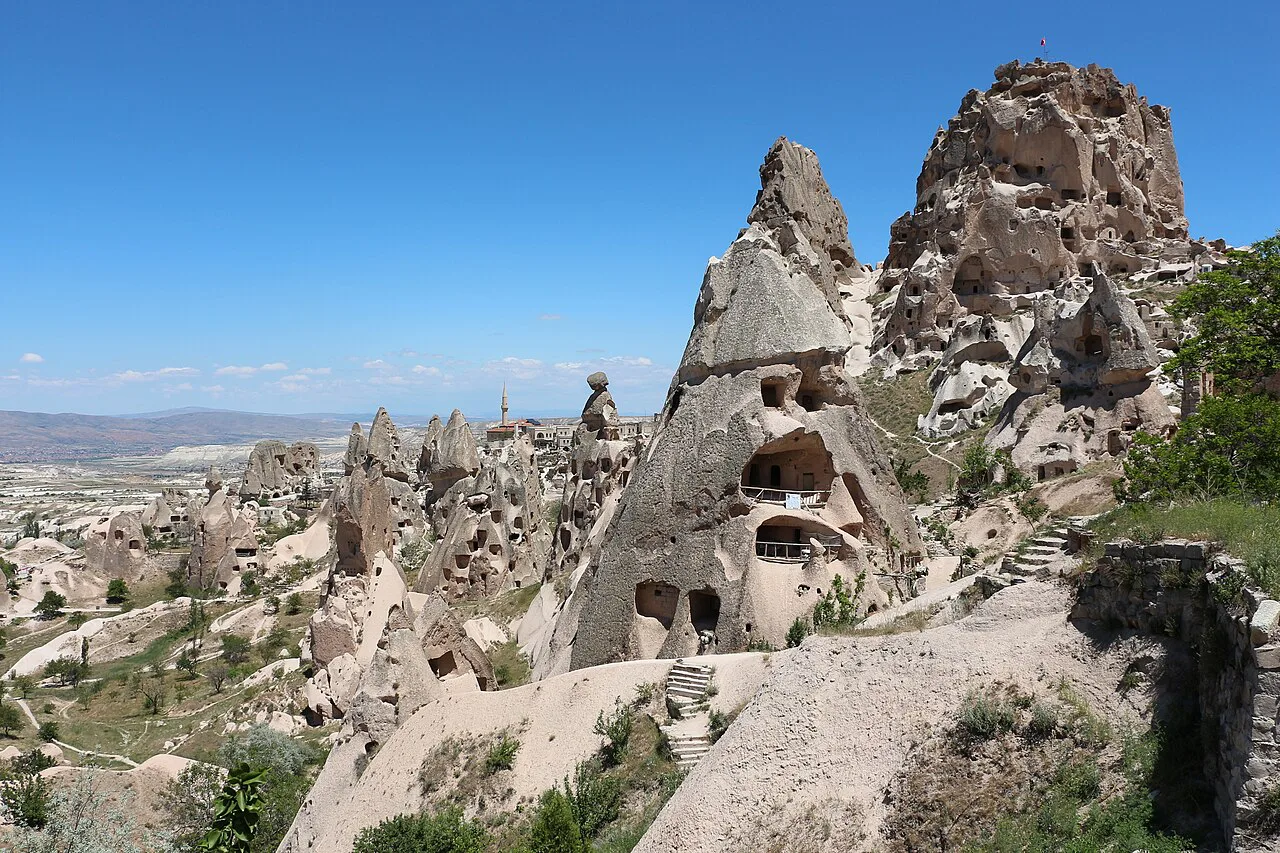 The rock of Uçhisar Castle and nearby fairy chimneys in Cappadocia.