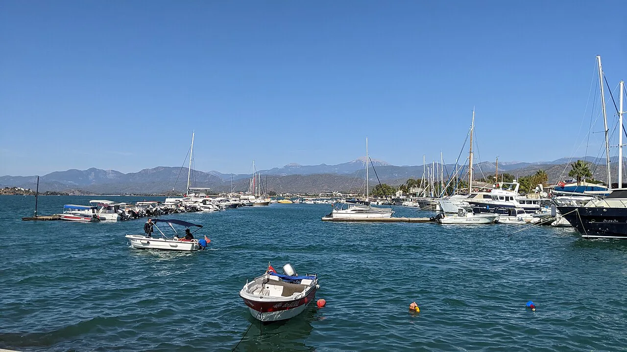 Boats in Fethiye harbour with the mountains behind.