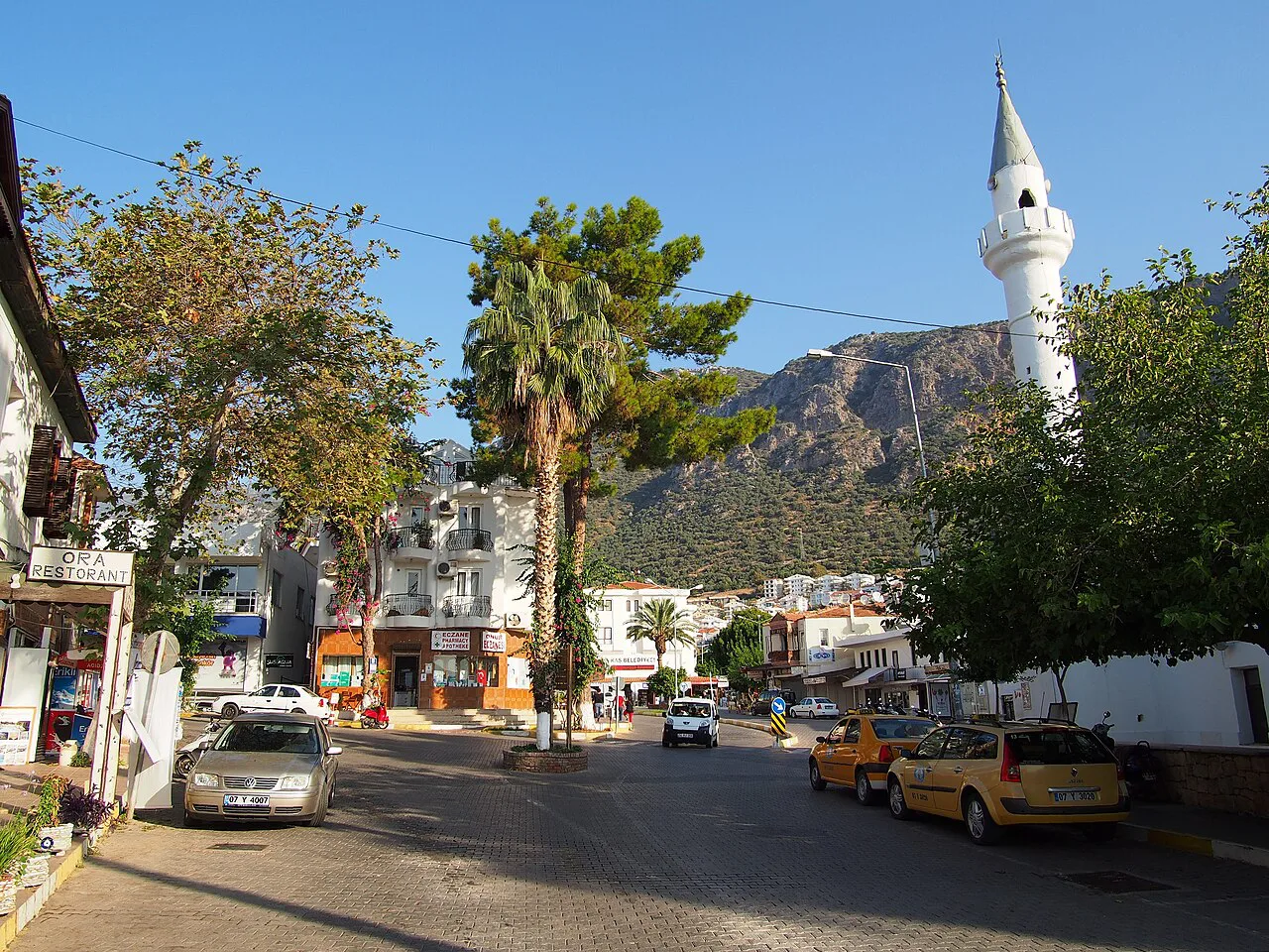 The main street of Kaş with a mosque minaret.